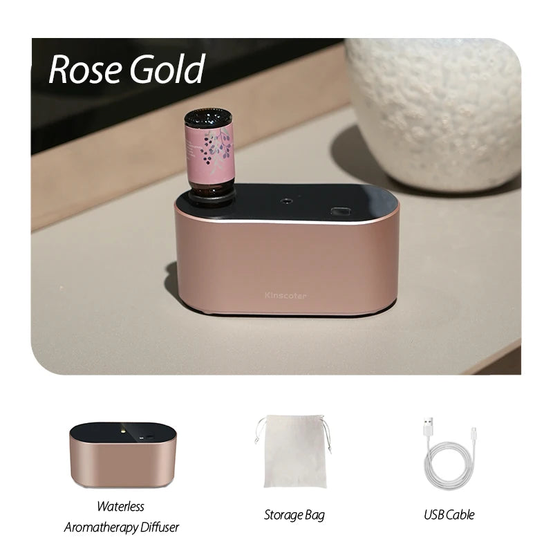 Rose Gold KINSCOTER waterless aroma diffuser with essential oil bottle, storage bag, and USB cable for stylish aromatherapy.
