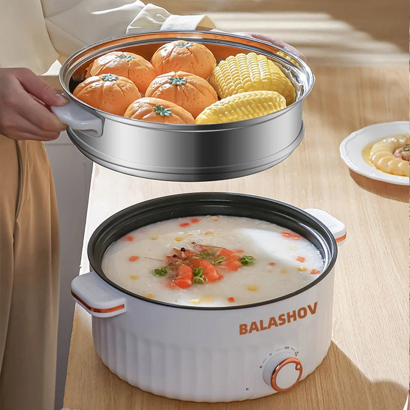 Electric Cooker with stainless steel steamer layer full of buns and corn