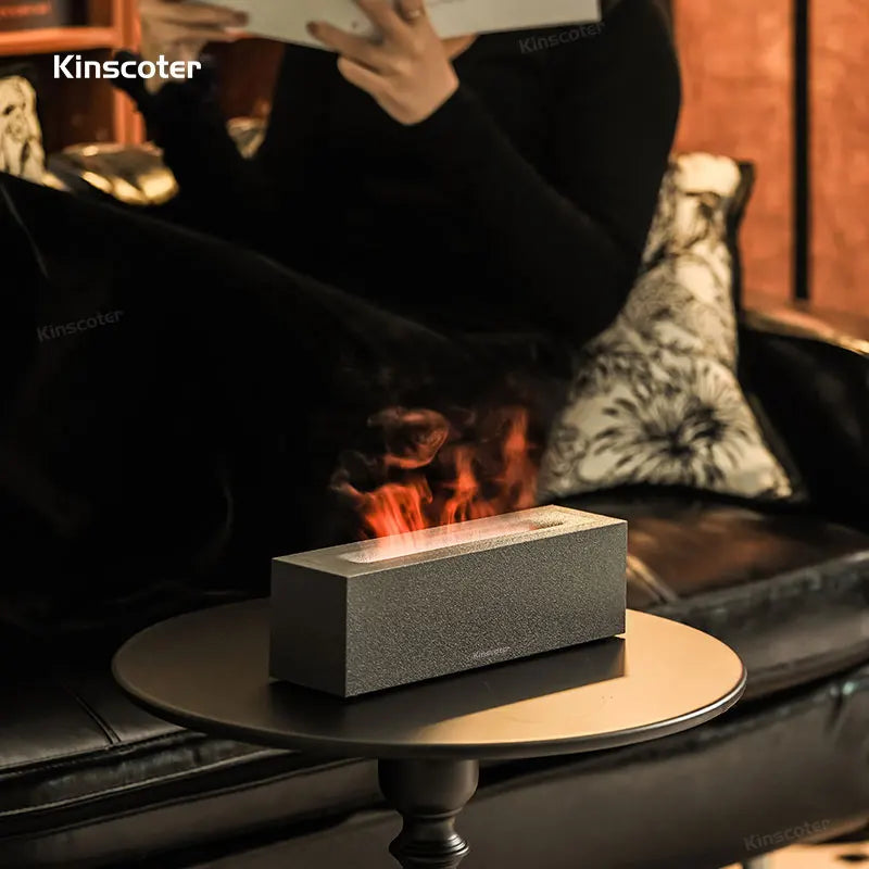 KINSCOTER dark grey flame diffuser creating cozy ambiance on a modern table
