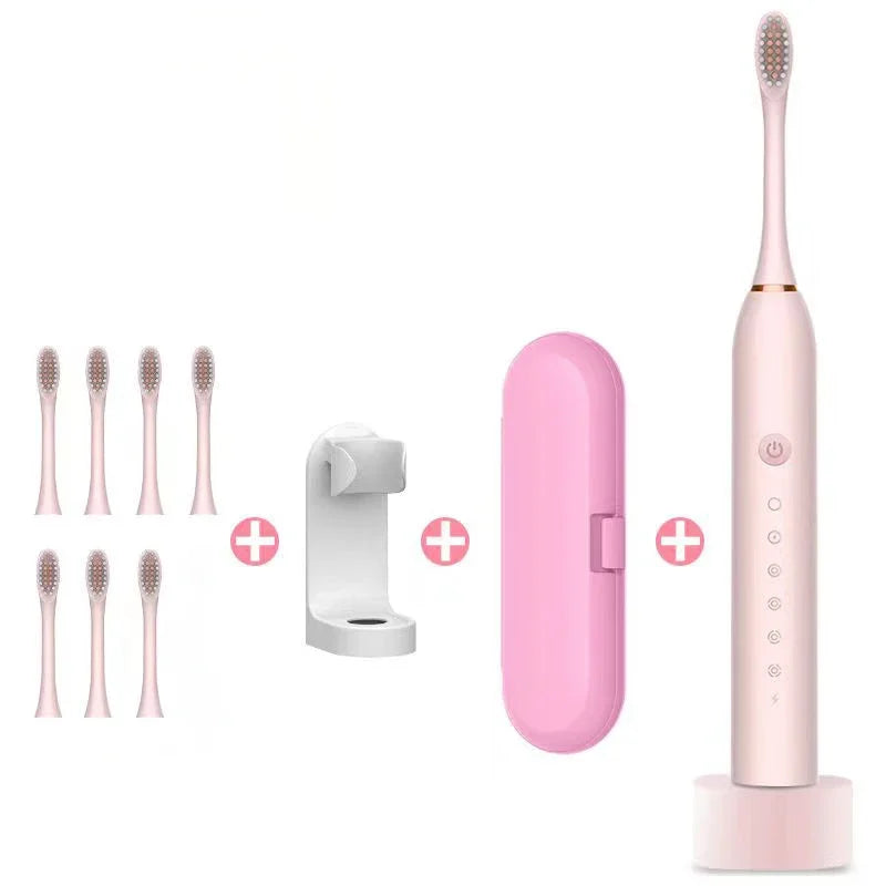 Full pink electric toothbrush kit with six heads, travel case, and wall mount