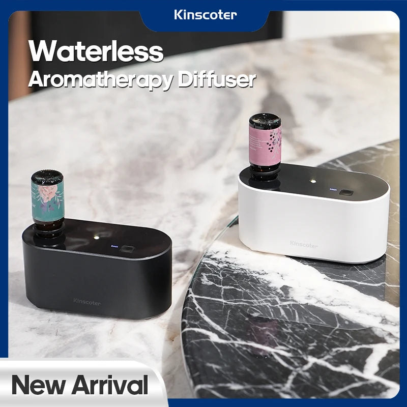 Black and white KINSCOTER waterless aroma diffusers with essential oil bottles on marble surface, marked as new arrival.