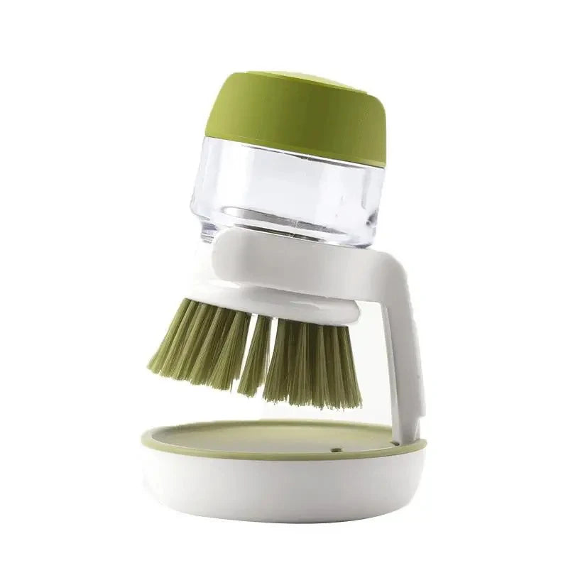 Green and white kitchen cleaning brush with container on a white background