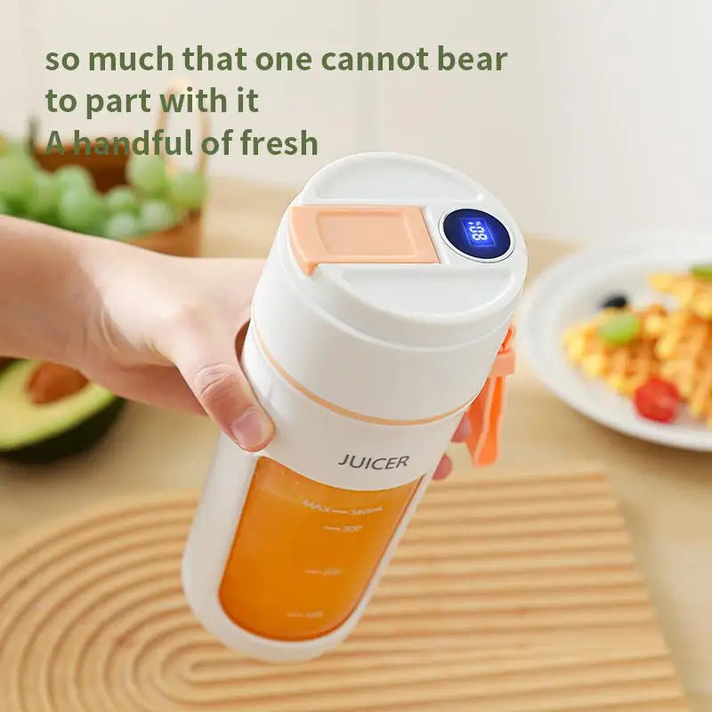 Hand holding a portable juicer with text about fresh juice on a wooden surface.