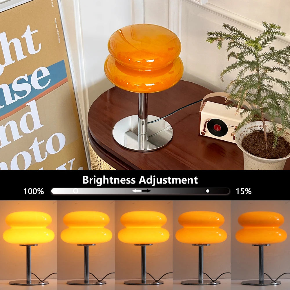 Orange stool on a wooden table with a plant and a magazine in the background, with brightness adjustment controls at the bottom.