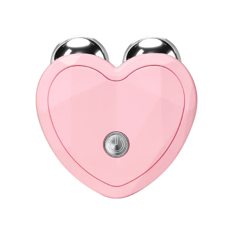 Close-up of pink heart-shaped face lifting microcurrent device