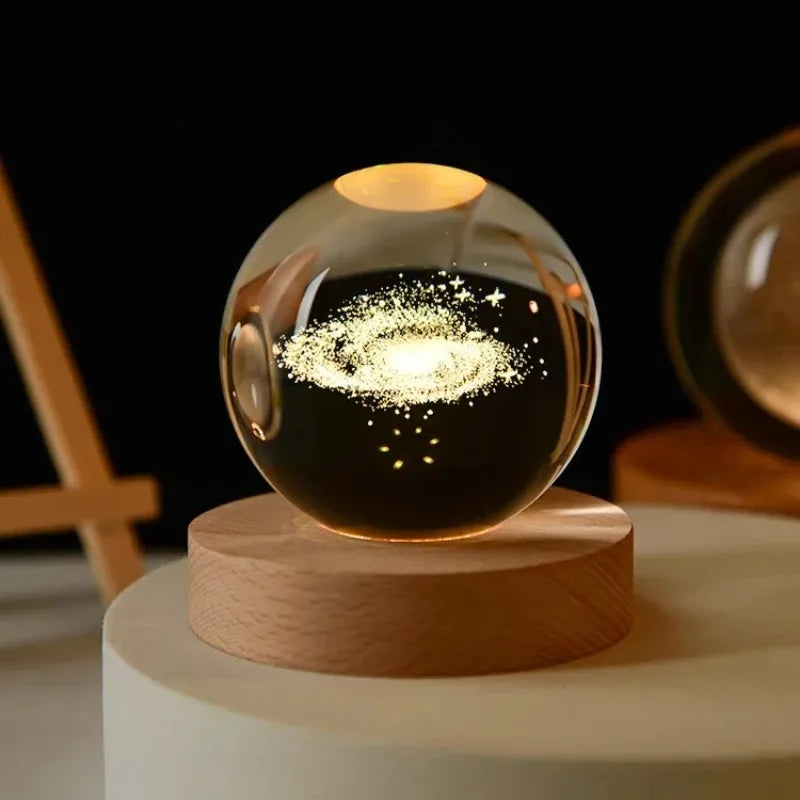 Glass sphere with glowing interior on a wooden base against a dark background
