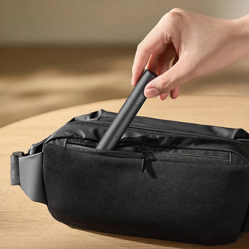 Compact and travel-friendly Xiaomi nose trimmer being packed in a small travel pouch